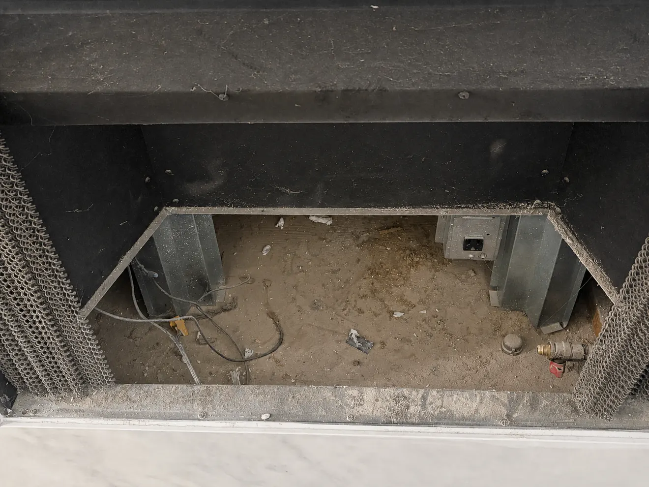 Dirty fireplace interior closeup before cleaning