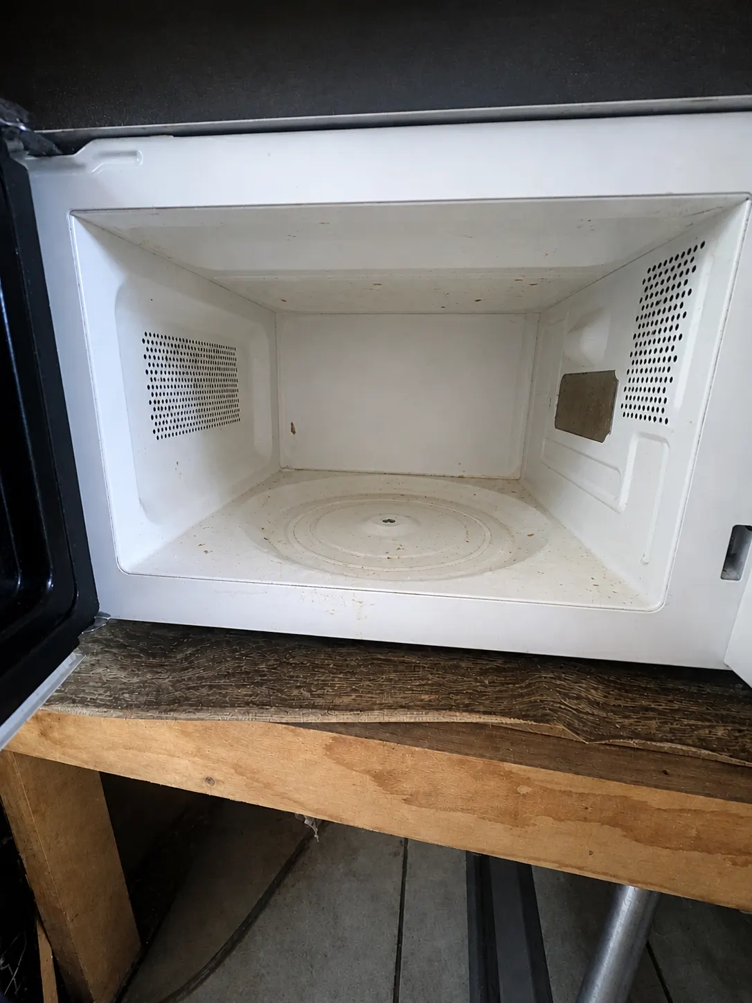 Dirty microwave interior before cleaning